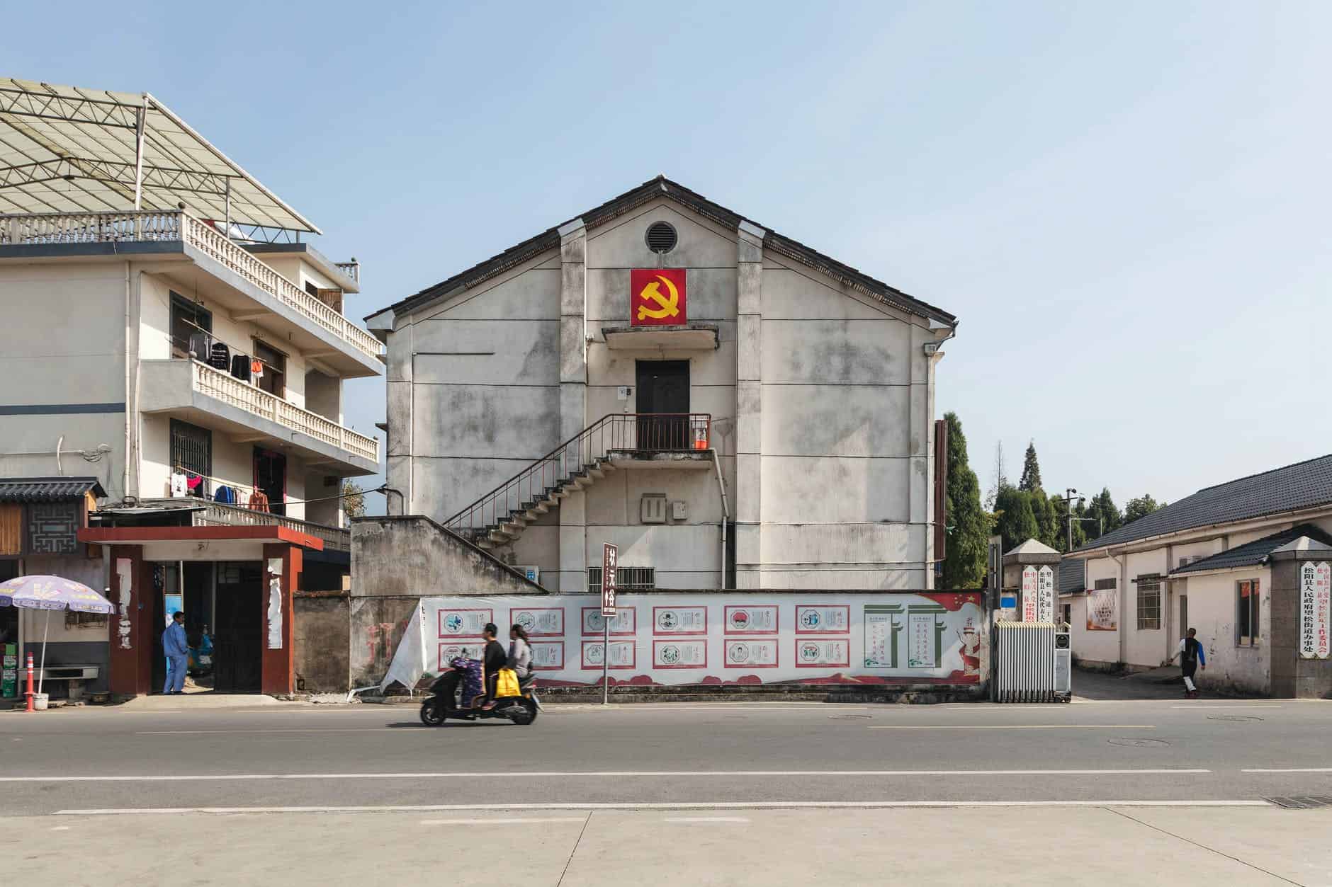suburban district buildings decorated with hammer and sickle emblem